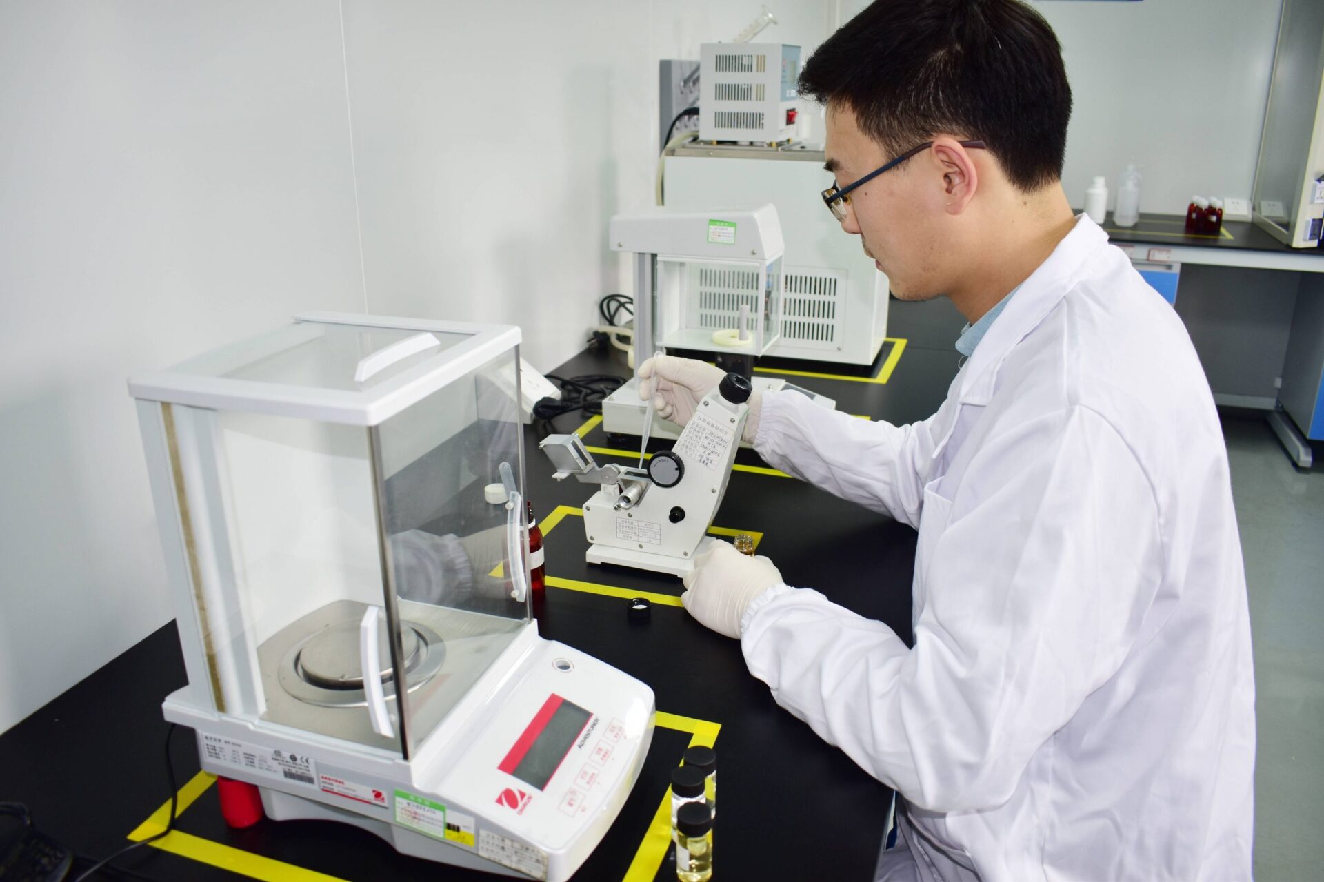 Magical Flavour team member evaluating a liquid flavour sample in the Xiamen lab
